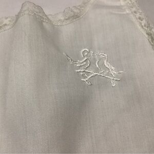 Vintage pre-owned slip Her Majesty white slip. 24 M with lace trim button back.
